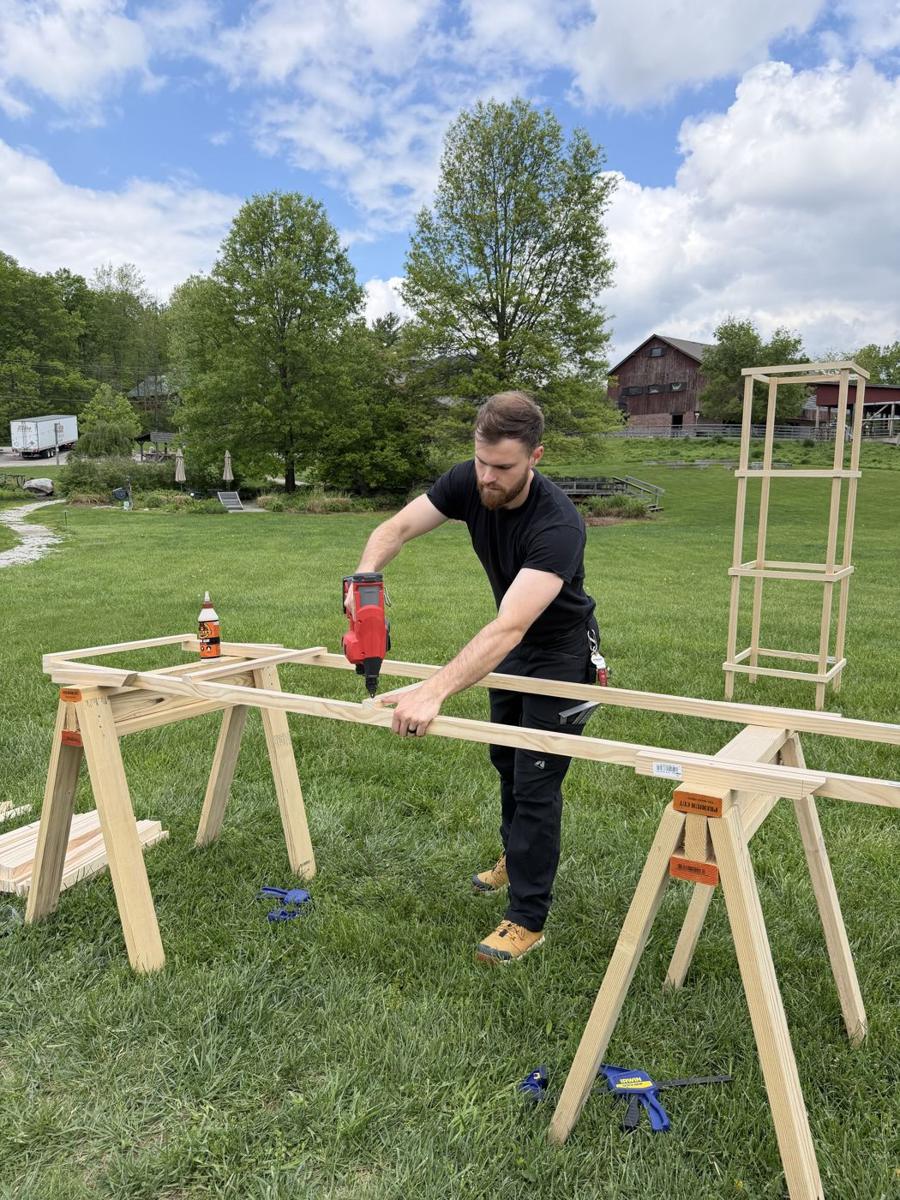 Cade Grubbs building a custom garden trellis