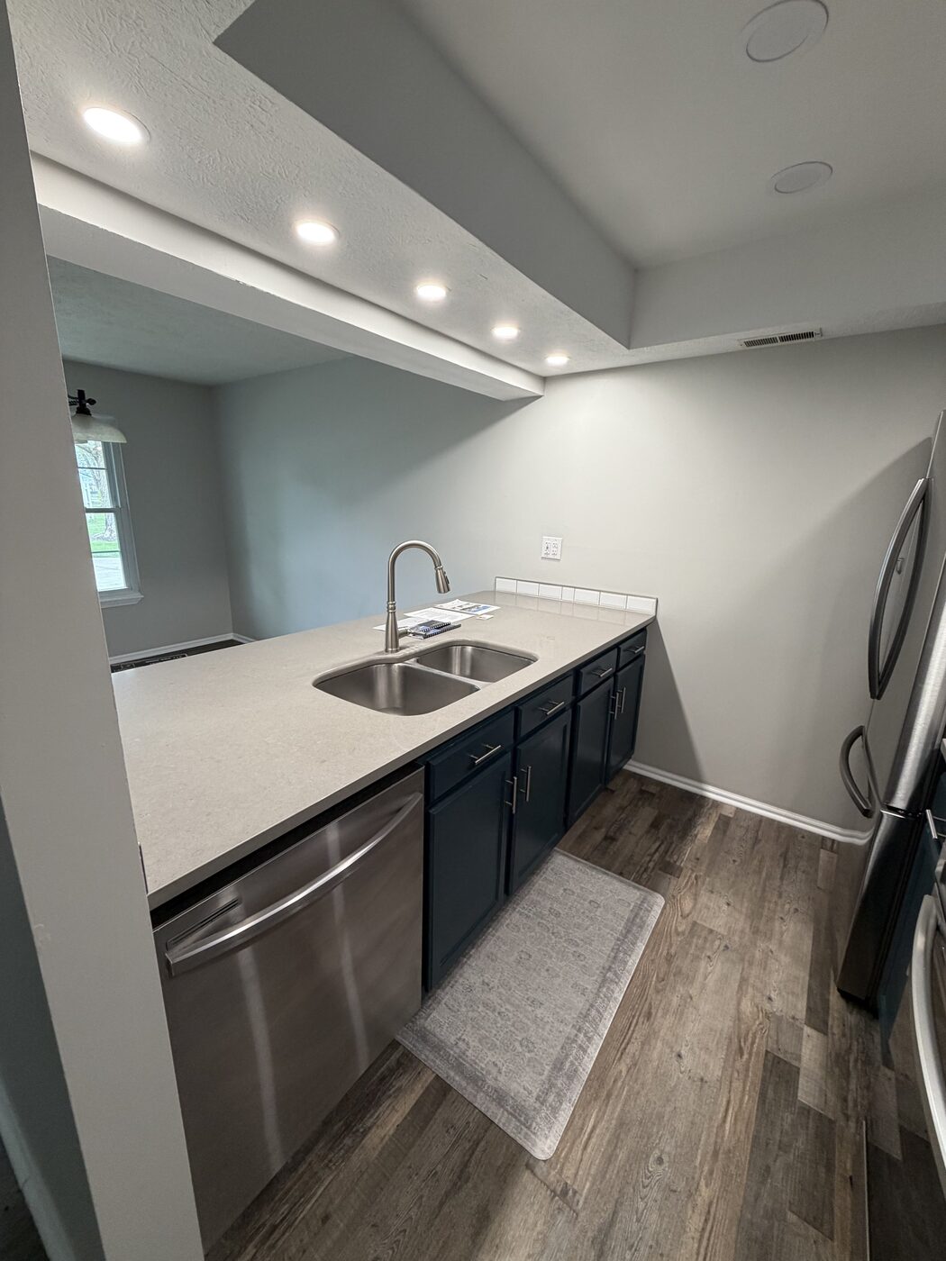 Modern kitchen lighting with recessed lights installed by Wood & Wire