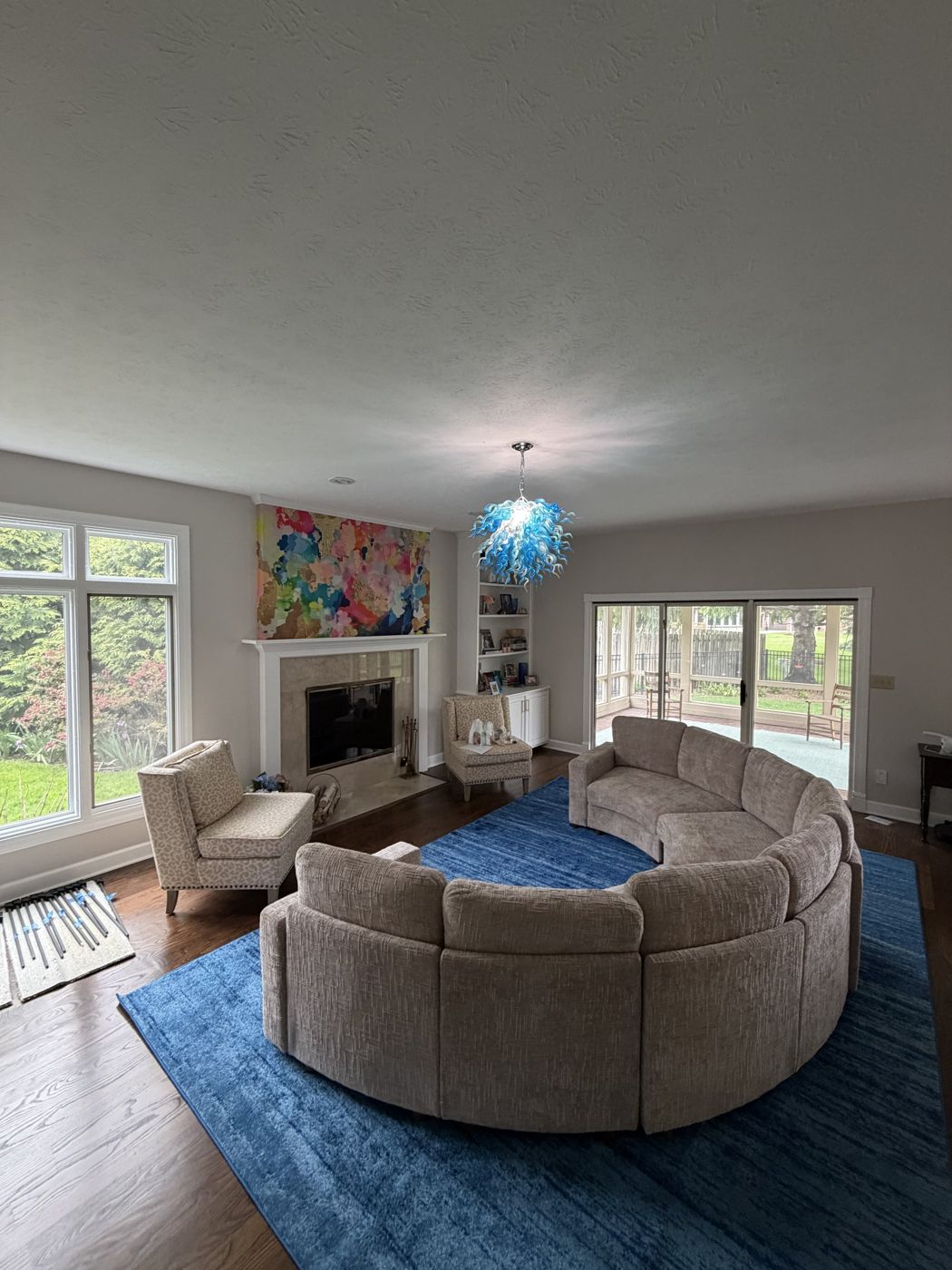 Statement chandelier installed by Wood & Wire in a living room