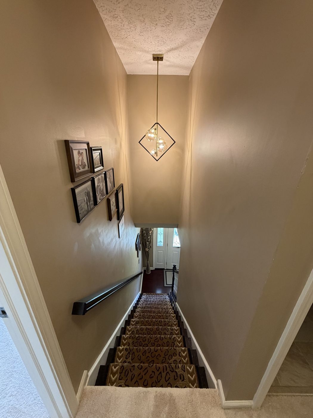Pendant light installed in a two-story stairwell